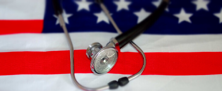 stethoscope over an american flag va aid and attendance