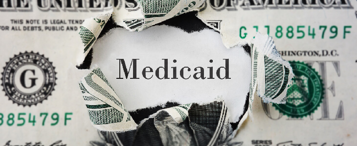 medicaid in the middle of a ripped dollar bill qualified income miller trust